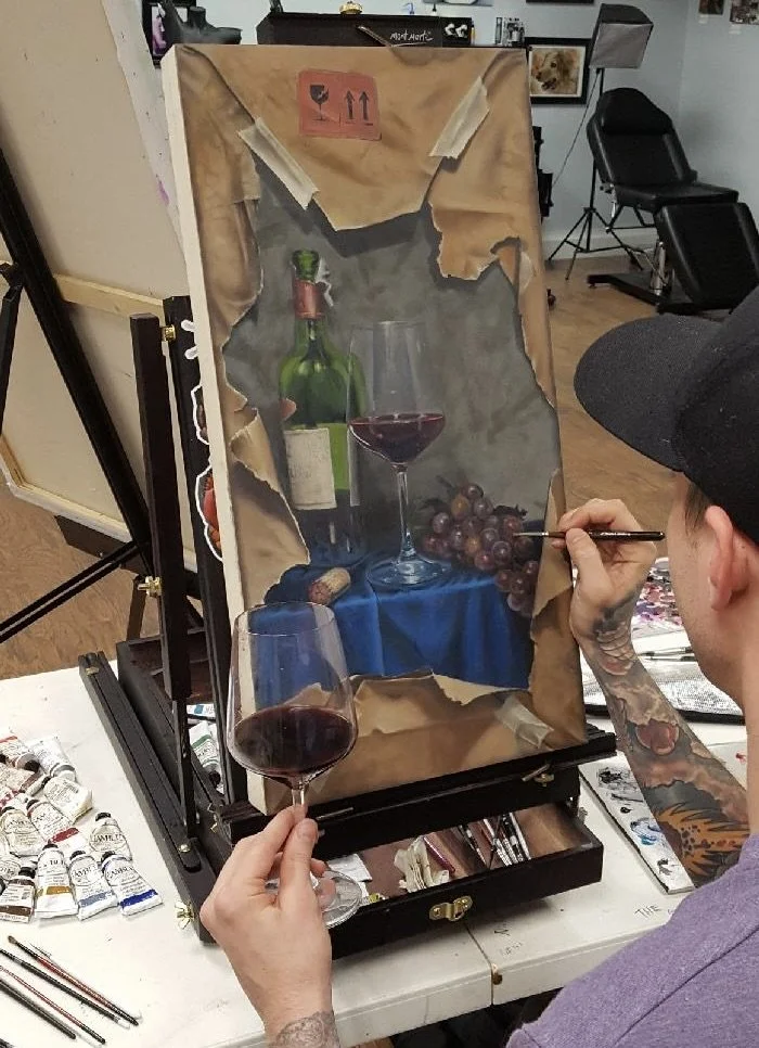 Andrew Matela painting fragile wine still life in studio Austin