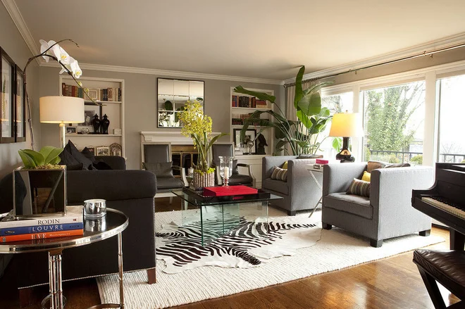 Love the idea of layering a large solid area rug with a patterned accent rug. (Photo Credit: Garrison Hullinger Interior Design)