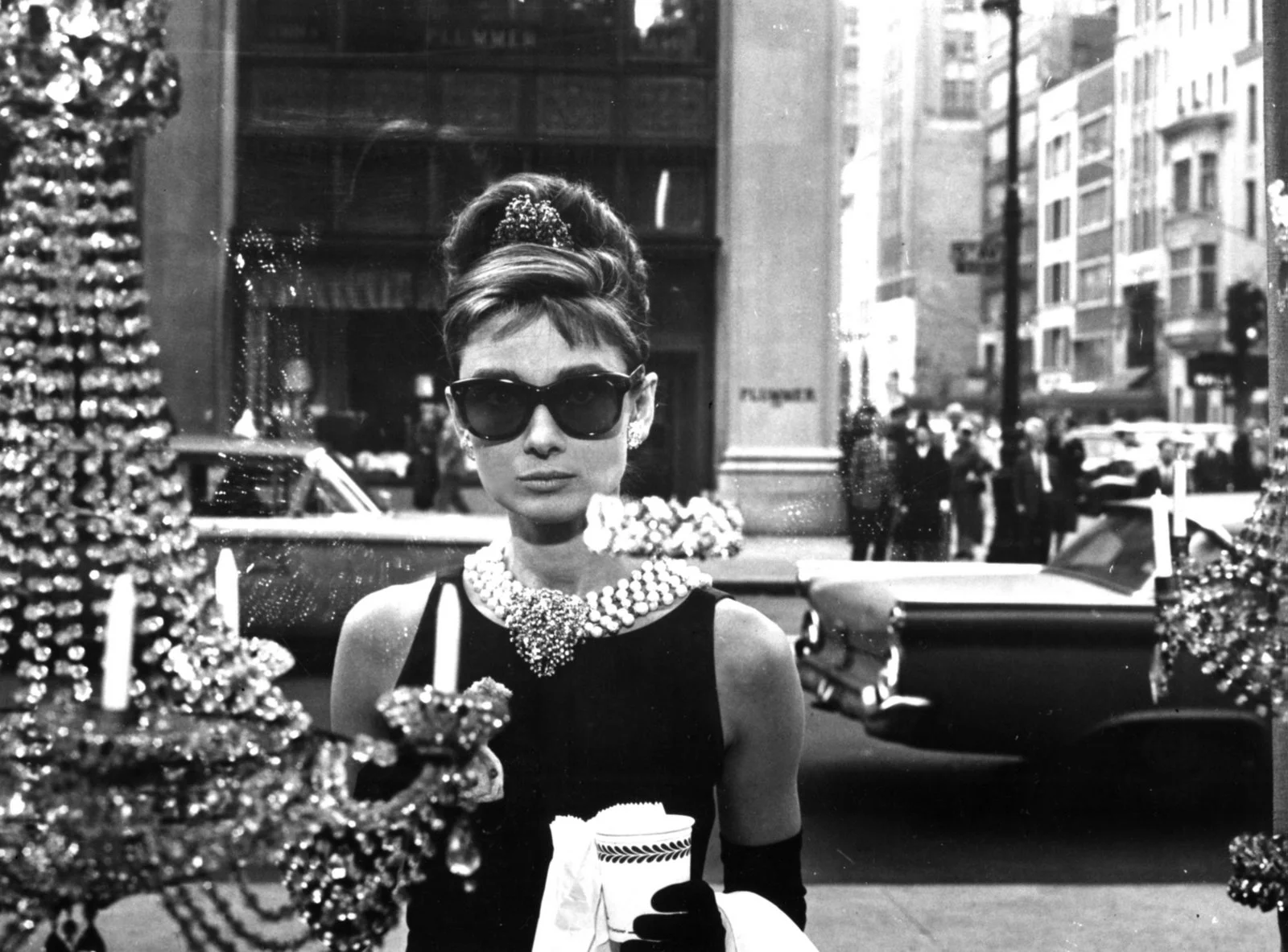 Audrey's sunglasses worn in Breakfast at Tiffany's were from the iconic brand Oliver Goldsmith. You can still buy them here.