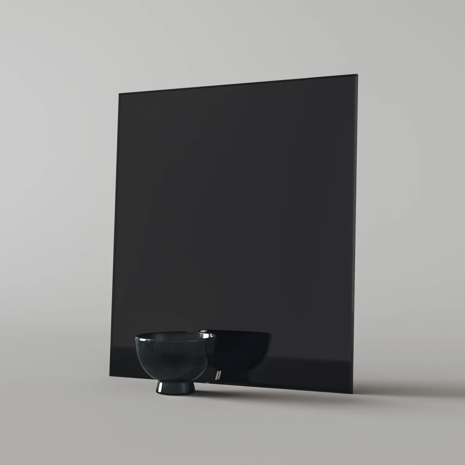 Studio photo of black glass swatch by Color & Mirror