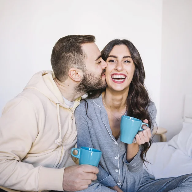 couple-with-cups-kissing_23-2147766898.jpg
