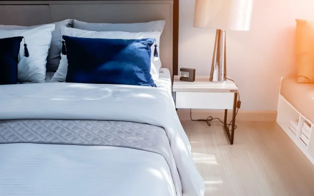 bed-maid-up-with-clean-white-pillows-and-bed-sheets-in-beauty-room_9693-1868.jpg