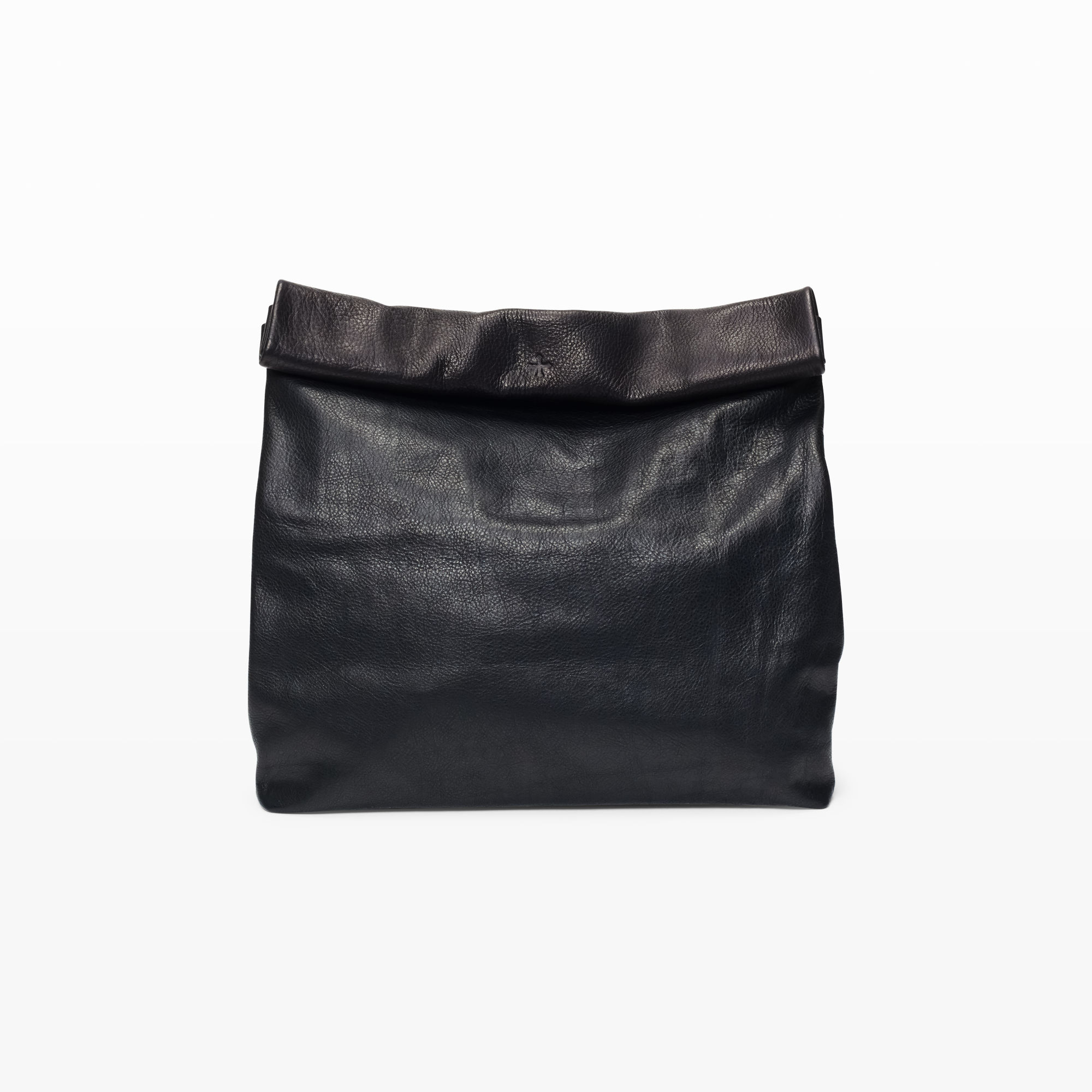 The Feast Clutch An oversized version of the brand's Lunch clutch—the Feast reimagines the iconic paper lunch sack in new, larger proportions that will easily carry all your daily essentials and more. Crafted in soft, pebbled leather, it features an unlined silhouette, interior patch pocket, and a roll top that securely shuts with a hidden magnet. MARIE TURNOR $398