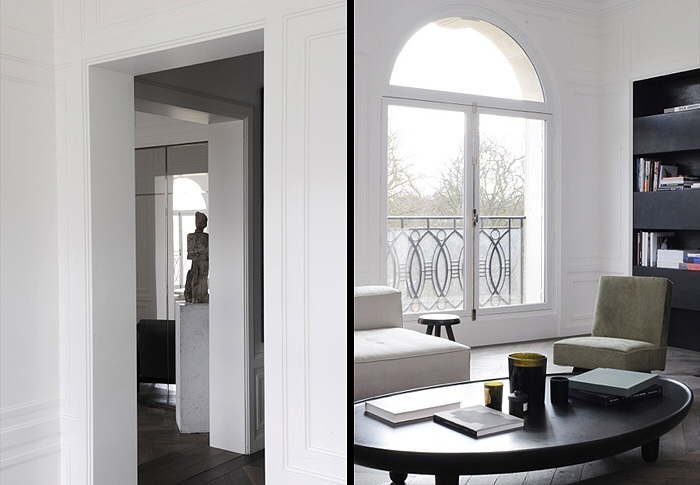 View down a hall way through a maze of doors. light sitting room and dark timbers.