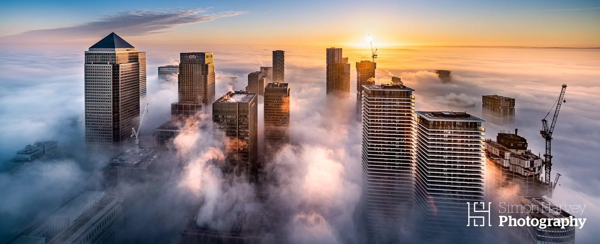 Photograph of Canary Wharf at Sunrise from 73rd floor of Landmark Pinnacle