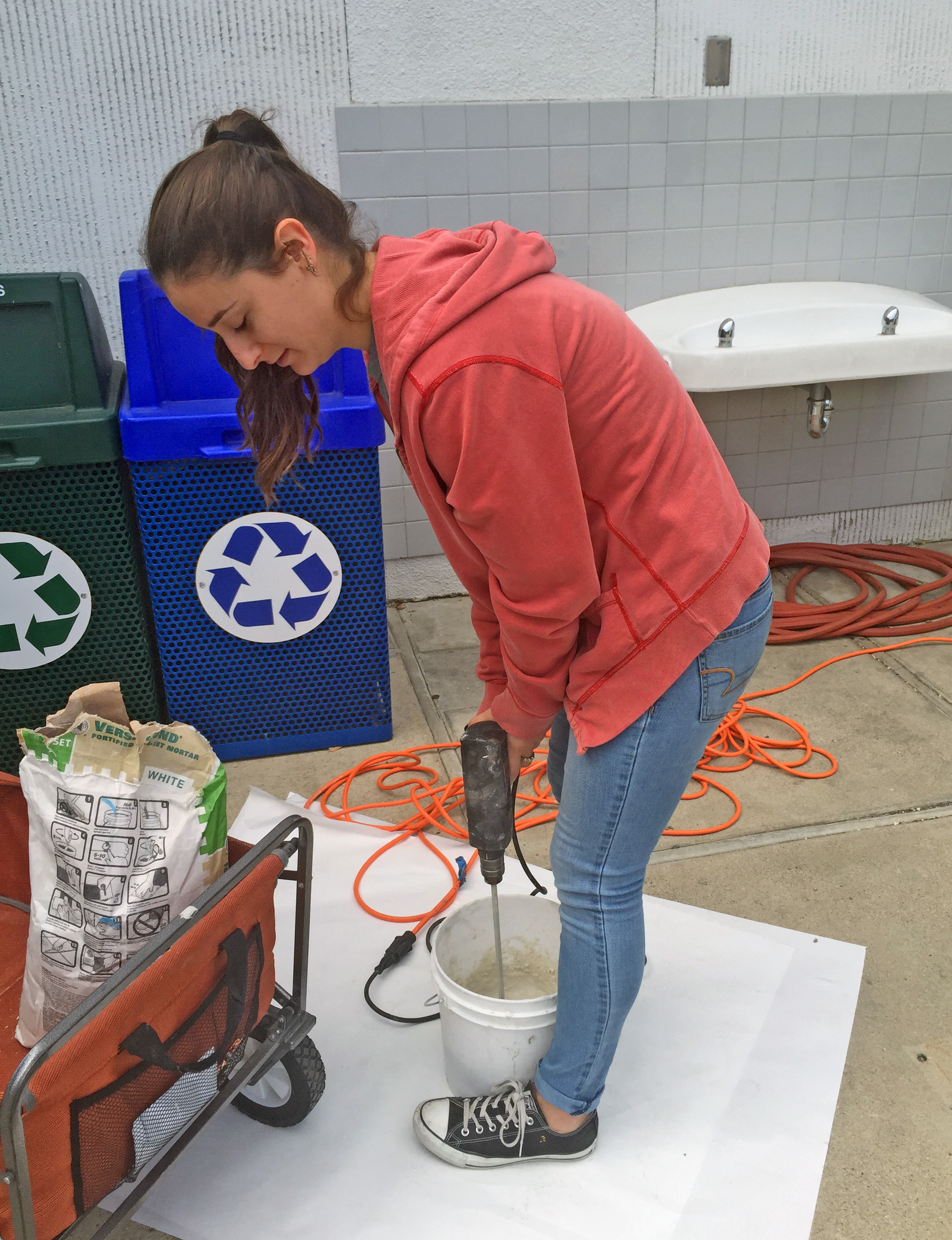 Alissa mixing thinset. Thinset is like a glue, it is used to stick the tiles to the wall!