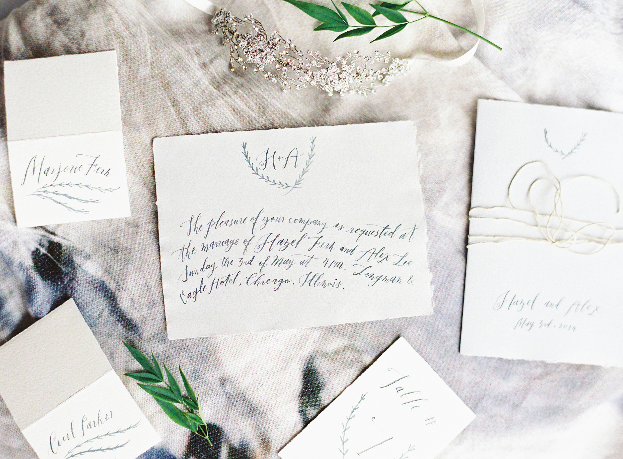   Photo by  Corinne Krogh Photography . Calligraphy by  Fox and Flourish .&nbsp;All handmade paper from Paper-Ya.  