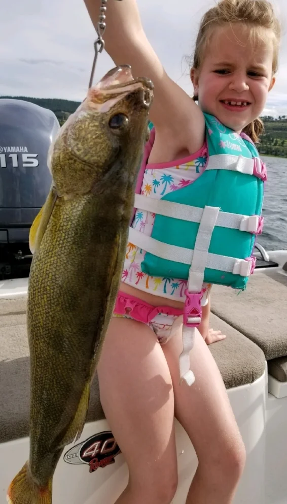 Lindsay K with a mixed emotions (fear combined with a sense of accomplishment). Her new personal best. 4lb 10oz measuring 24 inches. June 30th.