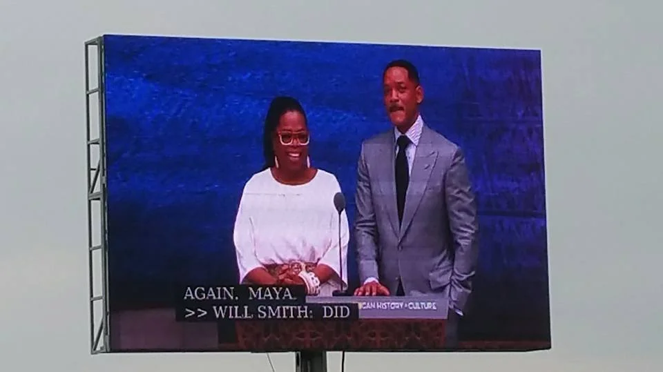 Oprah Winfrey and Will Smith present at the museum grand opening.
