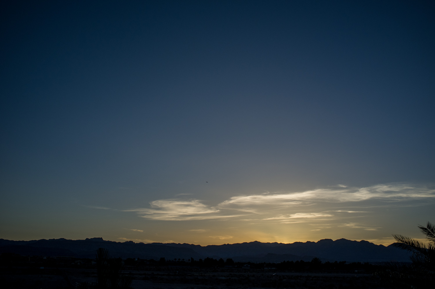 View from the house's balcony. The Nevada desert. There are lots and lots of mountains surrounding Vegas.
