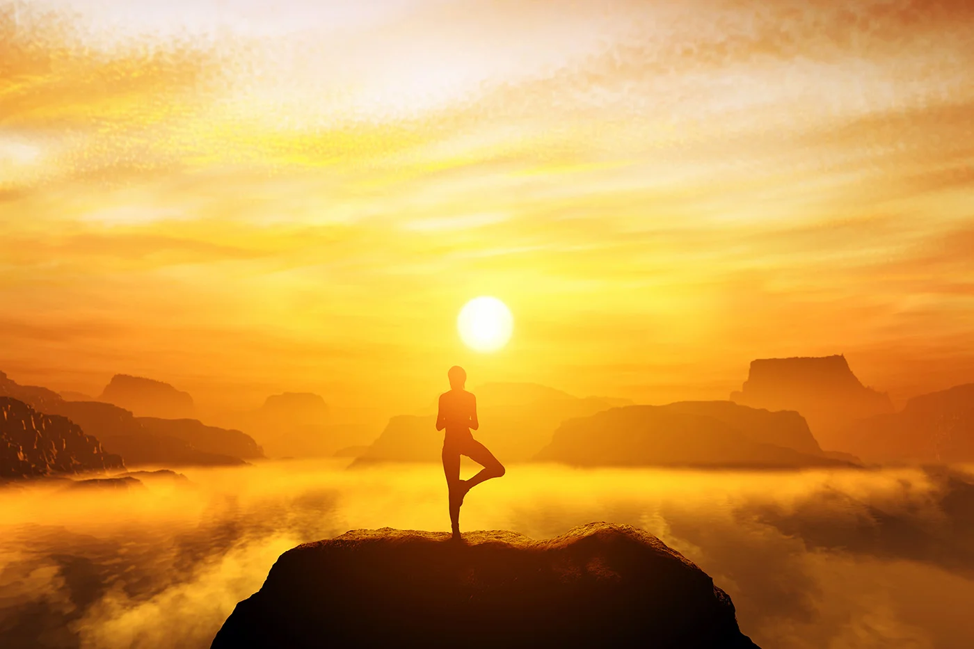 Woman meditating in tree yoga position on the top of a mountains