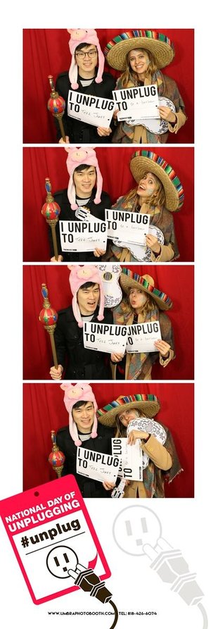 Two guests in the vintage-inspired photo booth at an NDU event.