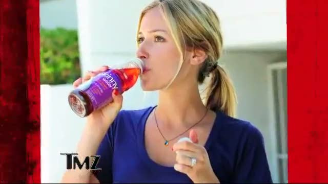 Figure 3. Kristin Cavallari with a bottled water while showing off her engagement ring