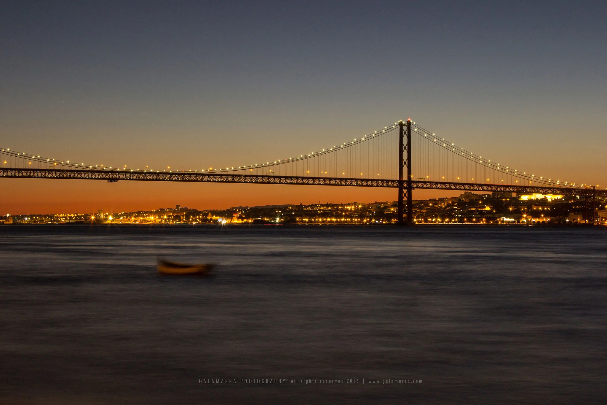 Tagus river bridge after sunset
