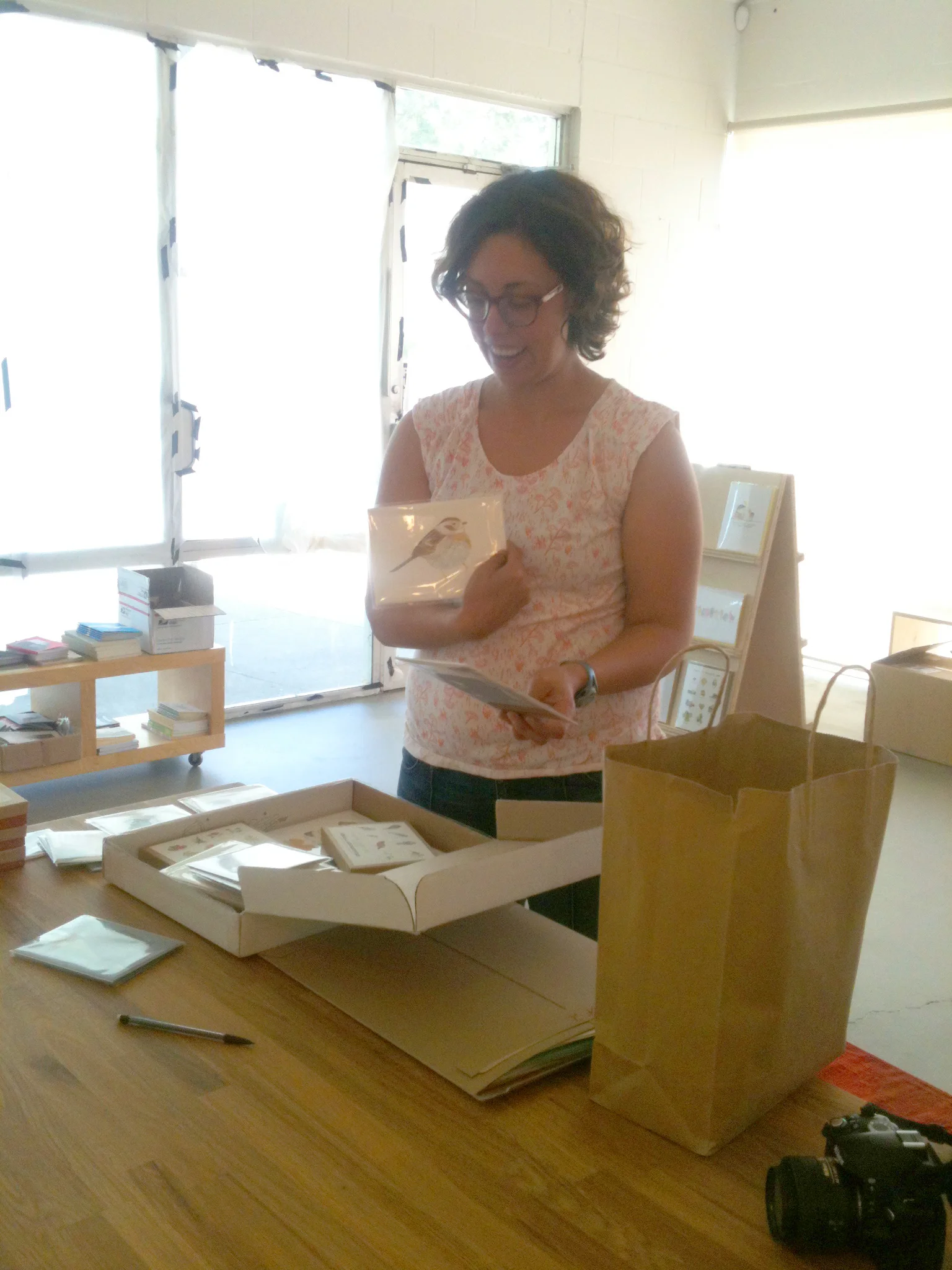 When I arrived, Bridget, the owner of Delta Workshop, greeted me with
her usual friendly smile. Here she is showing me some of her stationery
selection. 