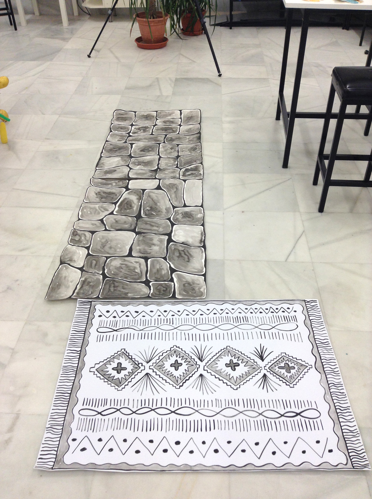 Stone and rug large ink drawings.
