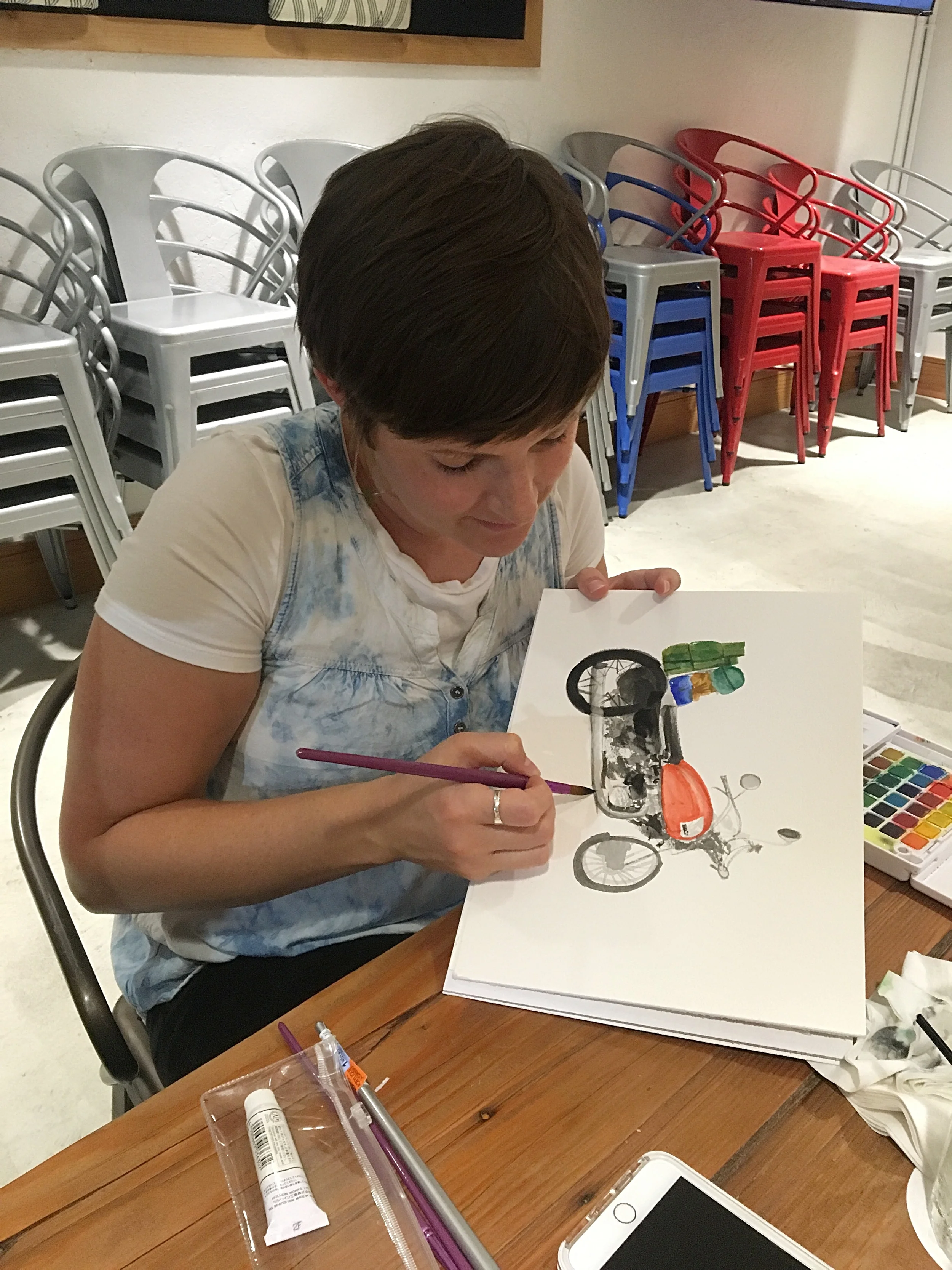 Tara working on her motorcycle camping painting