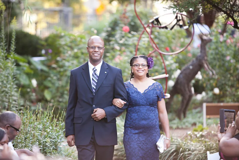 Alison Robinson smiled all day (and she had every right to do so)! A beautiful picture captured by Cynthia of the mother of the bride escorted by her brother.