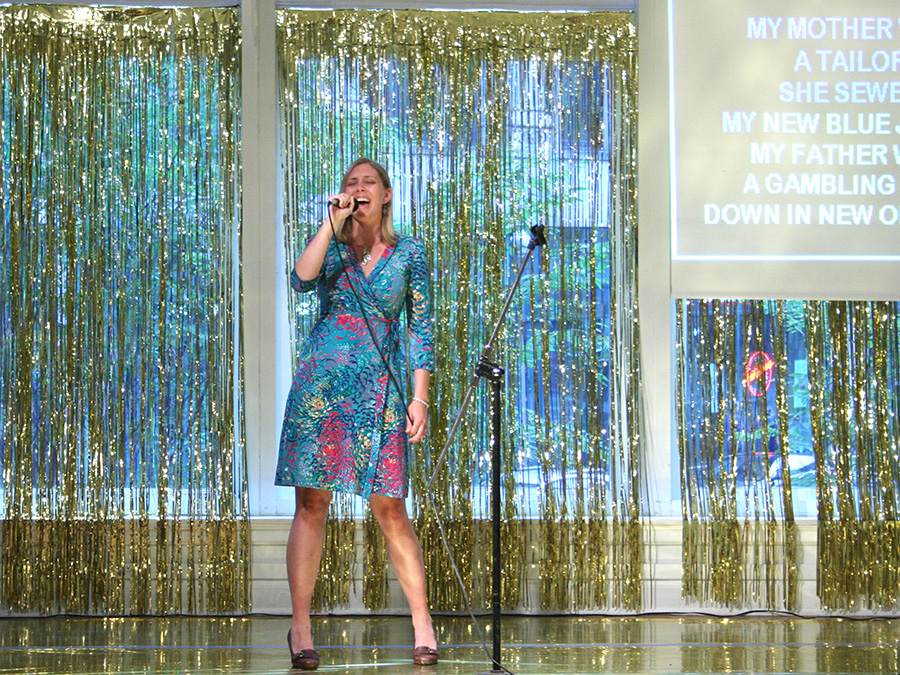   Audience member gets down during Quiet Karaoke.  