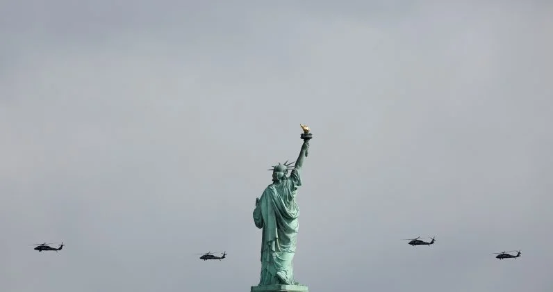  Military helicopters fly past the Statue of Liberty. Jersey City, NJ. 