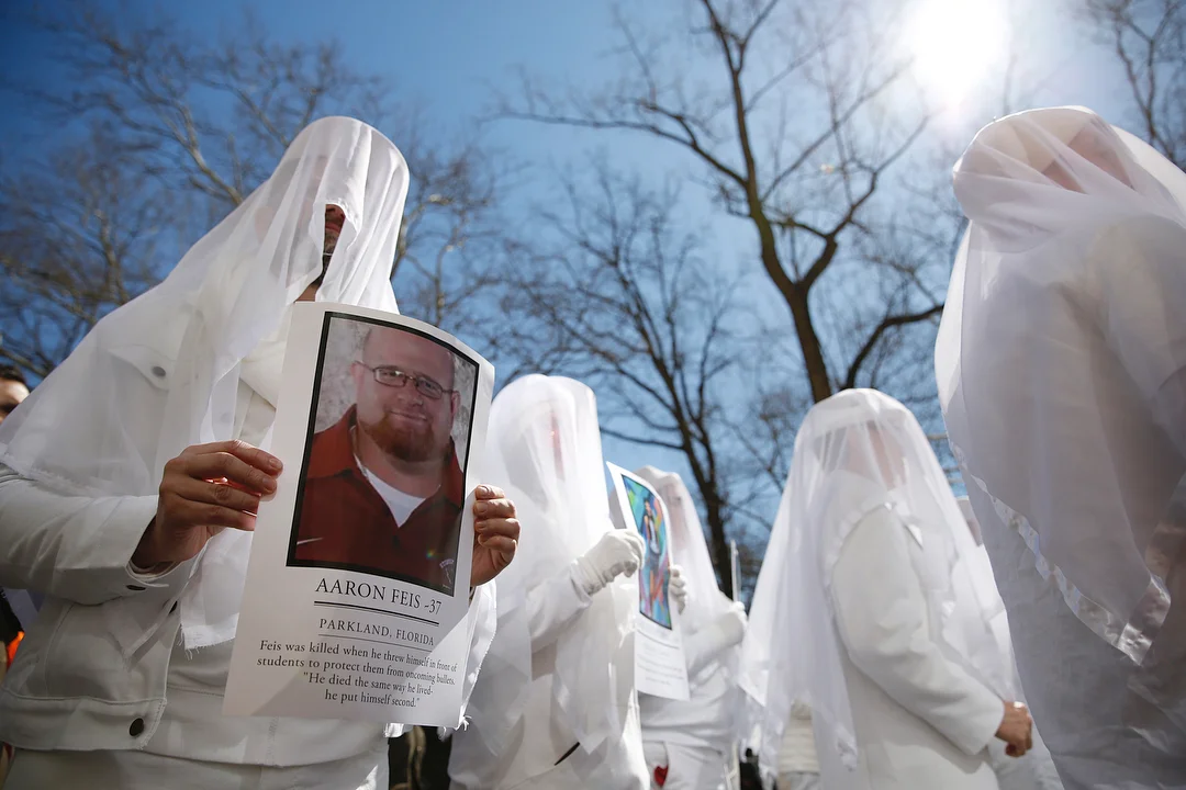  Dress in white activists remember the fallen victims subjected to gun violence during the March for Our Lives in the borough of Manhattan, New York. 
