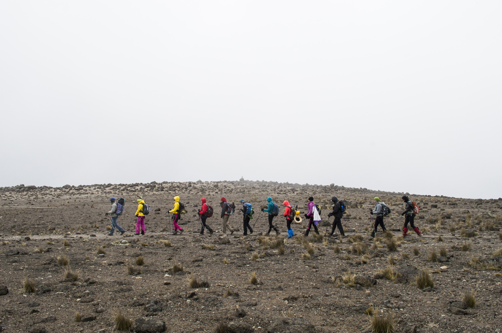 Our group of strong and mighty climbers trek across this dry and arid alpine desert before their summit on International Women's Day 2014!