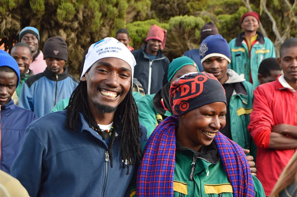 William, our lead Kilimanjaro guide, smiling with our awesome female porter!