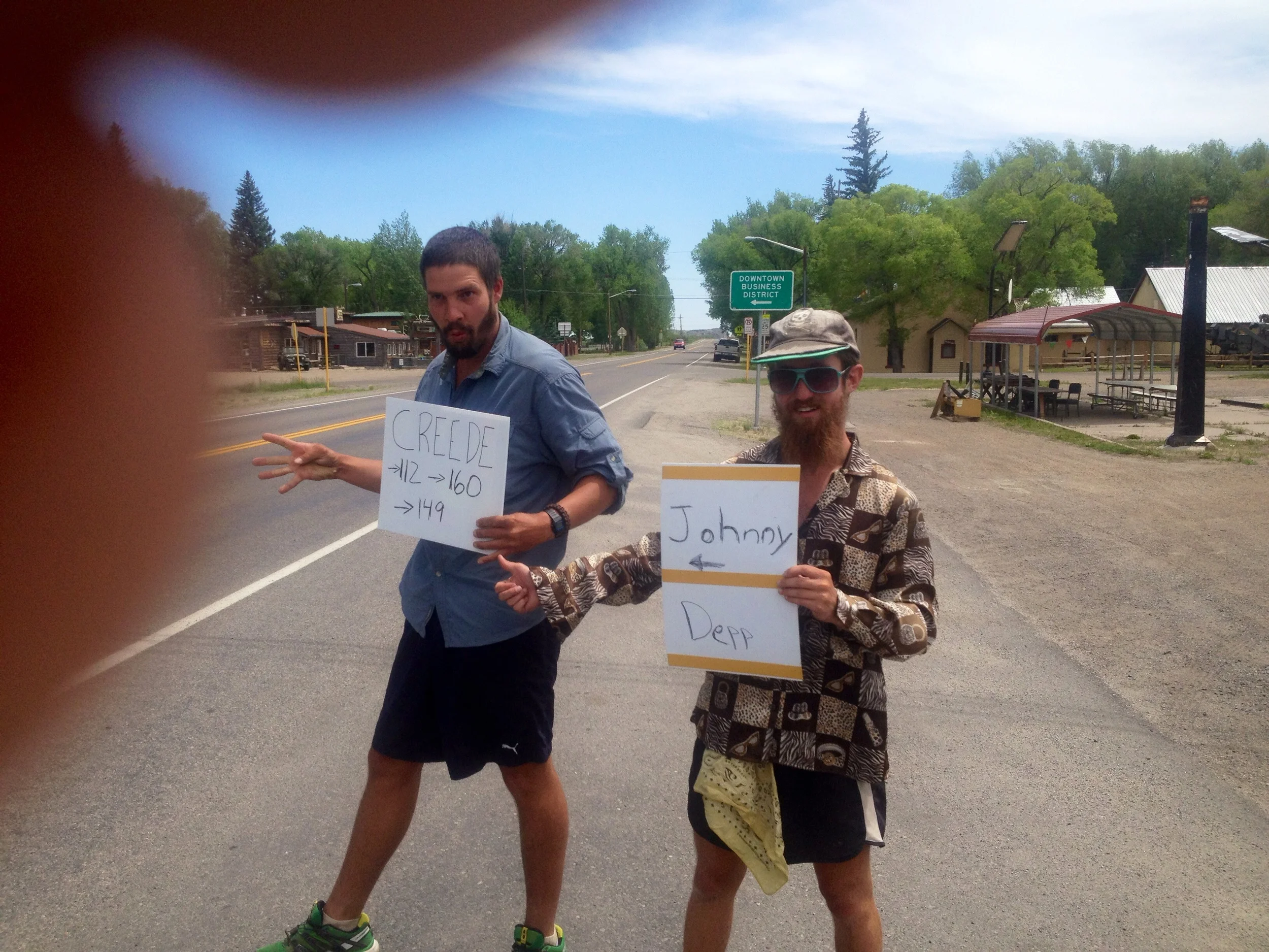 Unconventional hitching maneuvers in Southern, CO. Signs read "Creede" and "Johnny Depp <---" It was worth a shot.