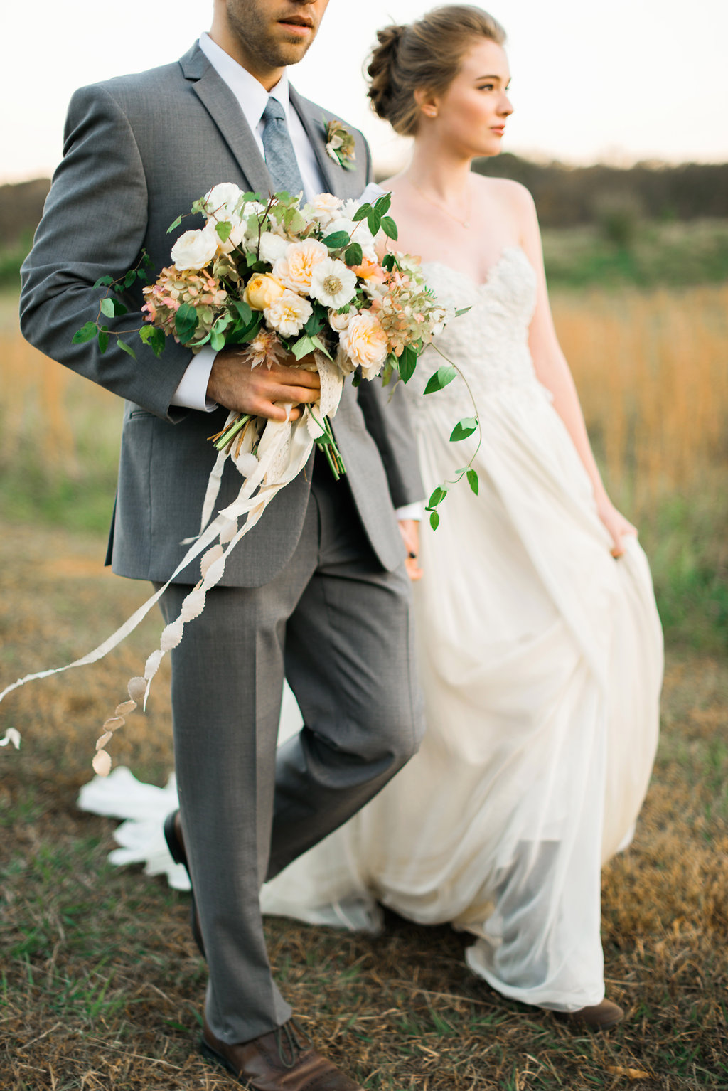 Photography: Rustic White Photography | Venue: The Stables at Foxhall Resort & Sporting Club | Planning: Molly McKinley Designs | Florals: Mary McLeod for Amy Osaba Events | Wedding Dress: Leanne Marshall from The Sentimentalist | Paper Goods: Written Word Calligraphy + Design | Hair & Makeup: Claudia Mejerle | Rentals and Tableware: Peachtree Tents & Events | Linens: I Do Linens | Men’s Suit: The Modern Gent