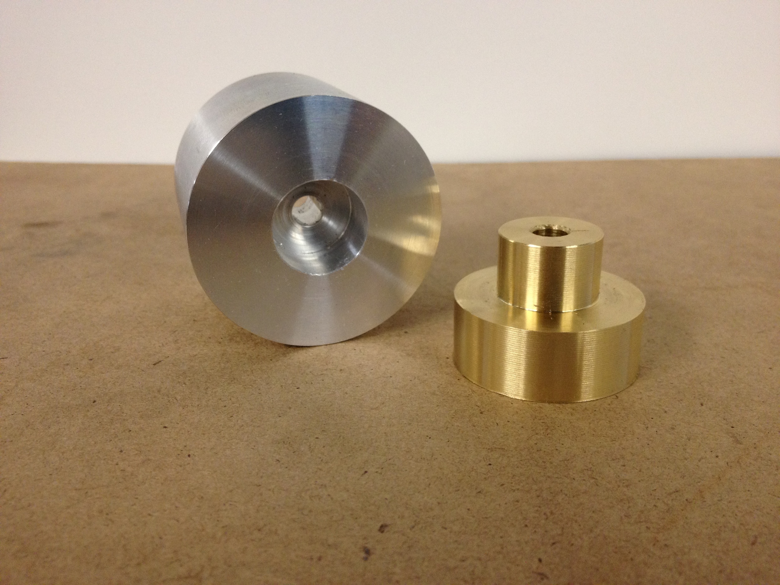  ​First, I turned, drilled, bored, and sized the aluminum and brass pieces separately. 