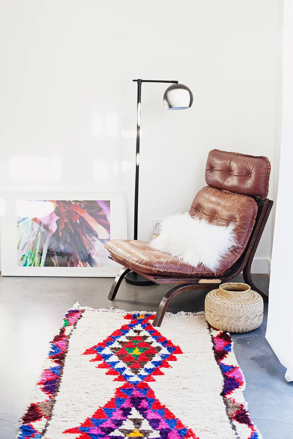 Photo print is from Kelly Christine ; chair found on Offer Up, Rug found on Etsy, lamp is from Target, sheepskin pillow from Nordstrom Rack, basket thrifted