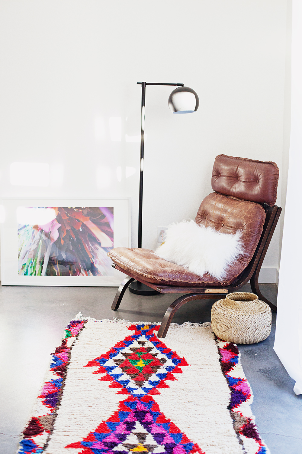 Photo print is from  Kelly Christine ; chair found on Offer Up, Rug found on Etsy, lamp is from Target, sheepskin pillow from Nordstrom Rack, basket thrifted