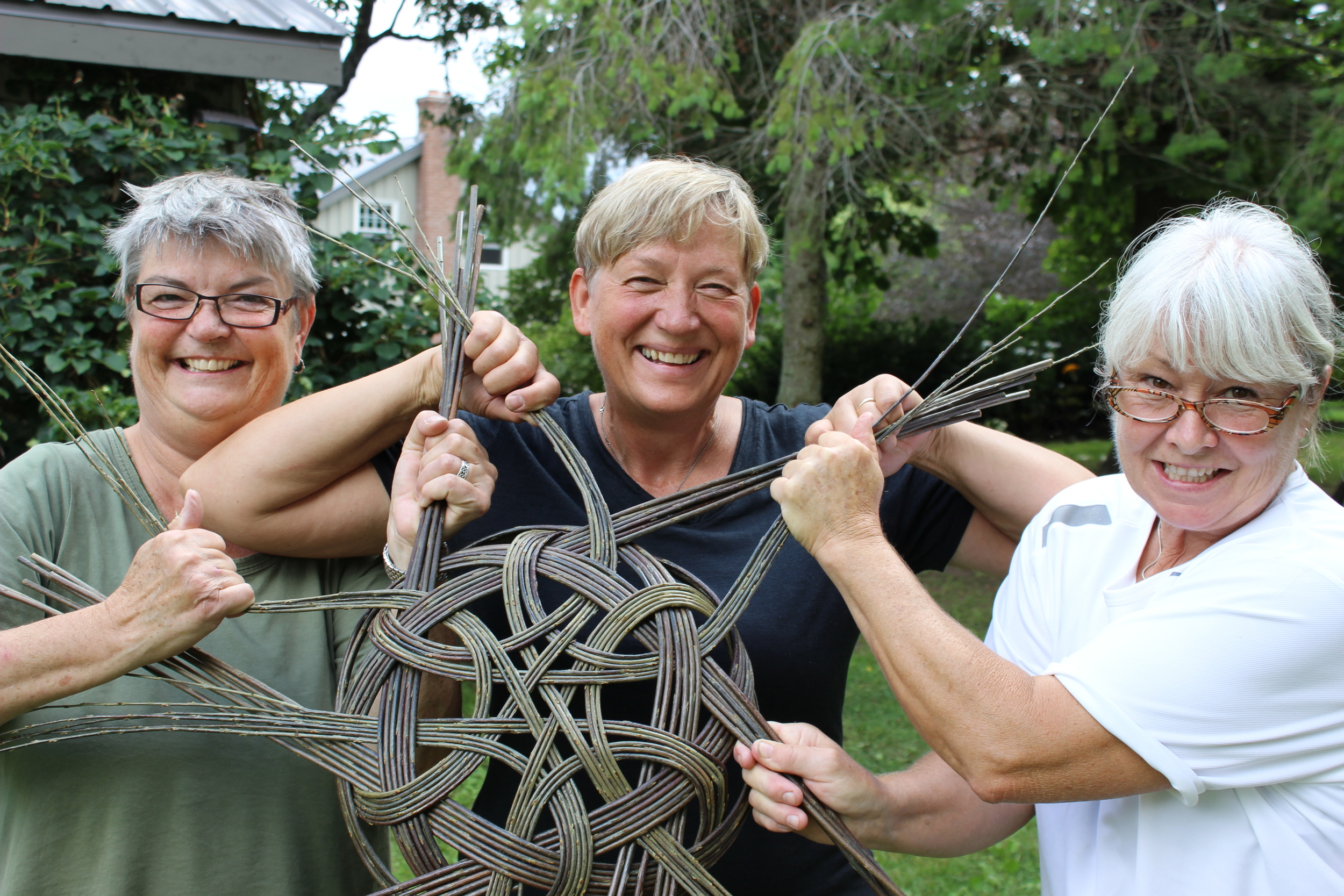 Christine , Lene and Jill tightening a tatza basket.