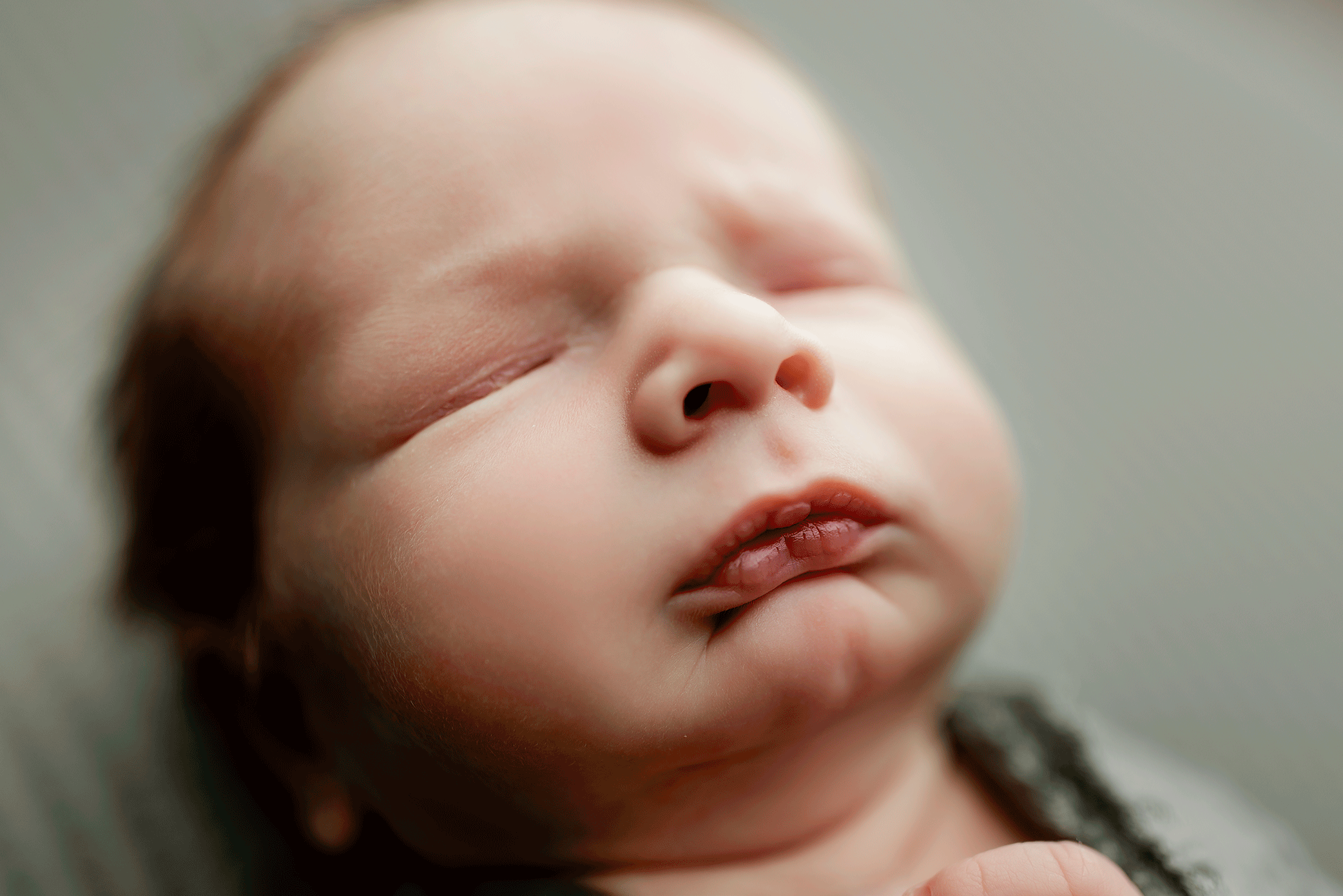 Close-up newborn detail photo highlighting soft lips and cheeks during a Salem newborn photography session.