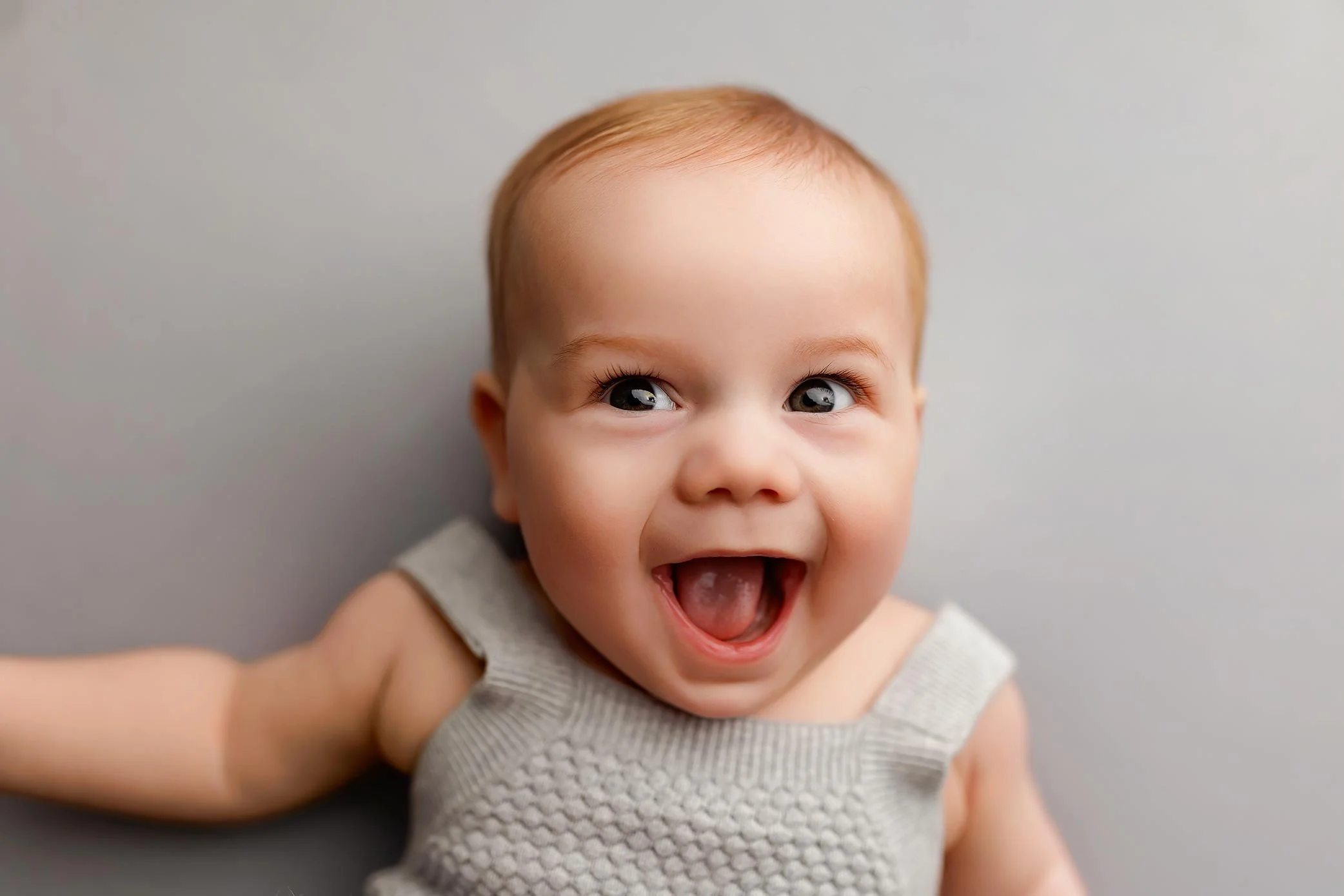 Smiling baby during a baby milestone photography session in Salem Oregon.