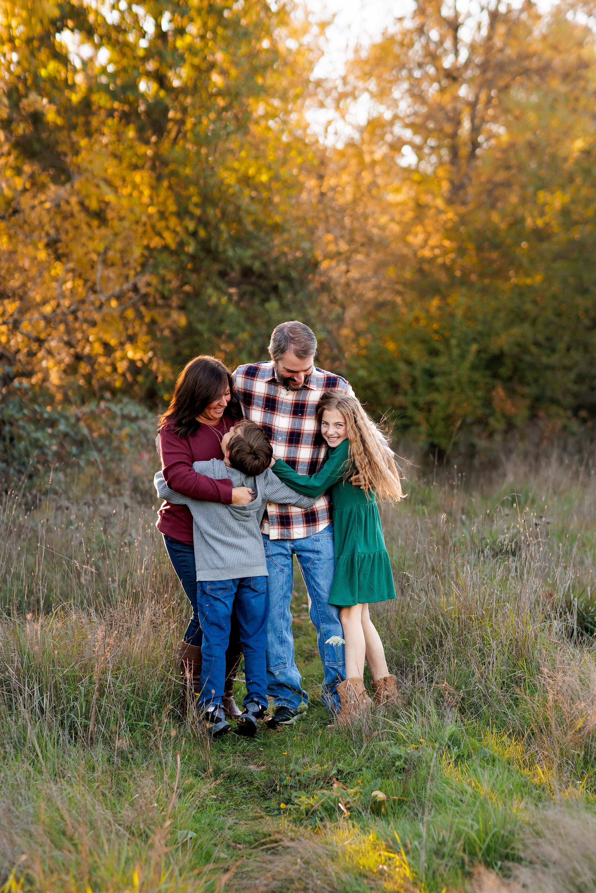 Family hugging during a Fall Family Photoshoot in Salem Oregon