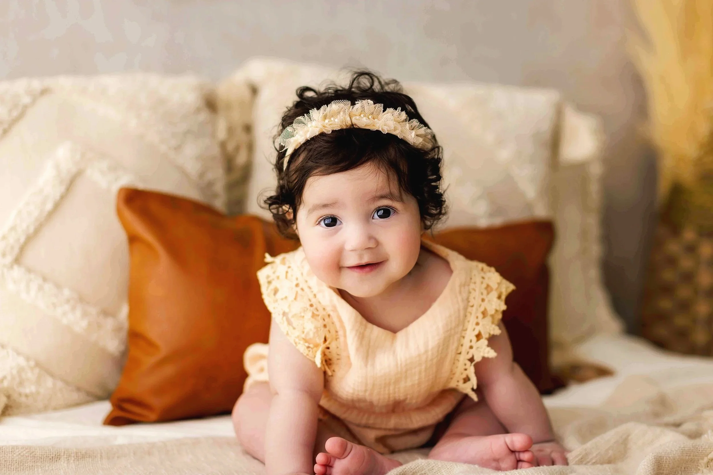 Baby girl sitting milestone session in Salem Oregon, natural light portrait with soft neutral styling.
