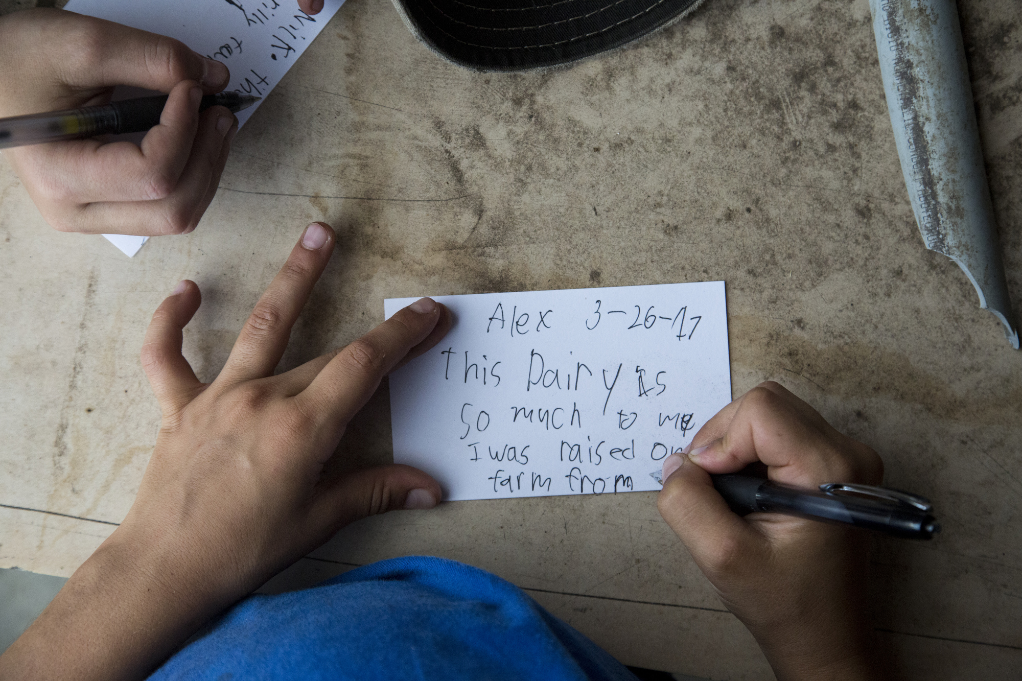  Jeff's son, Alex Busciglio, 9, writes a note for a time capsule that the Busciglio family hopes to leave buried somewhere on the Tower Dairy property in Tampa, on March 26, 2017. 