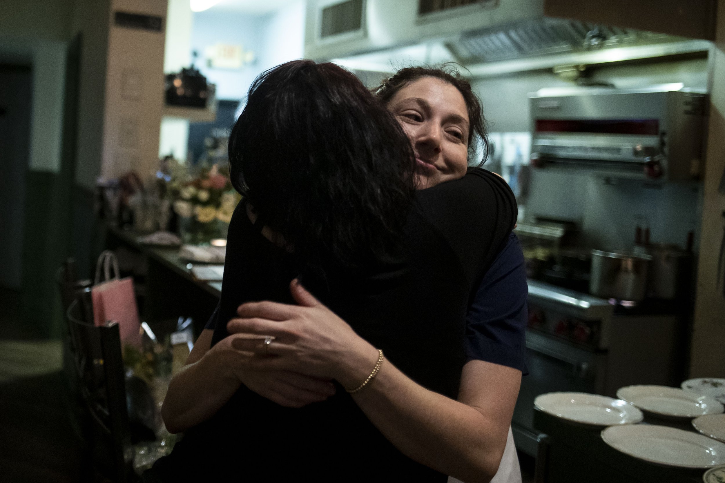  Chef and owner Amanda Shulman hugs Gigi Forbes at Her Place Supper Club. 