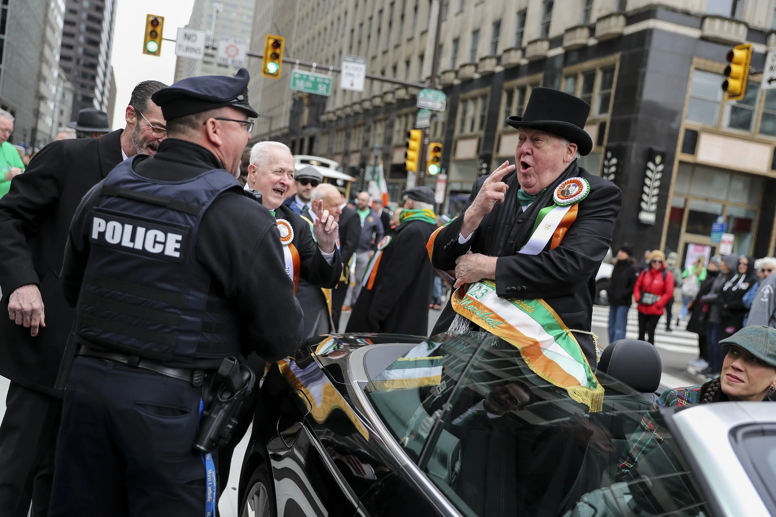  Grand Marshall Dan Harrell talks with officers before the start of the St. Patrick’s Day Parade in Philadelphia, Pa. on Sunday, March 12, 2023.  
