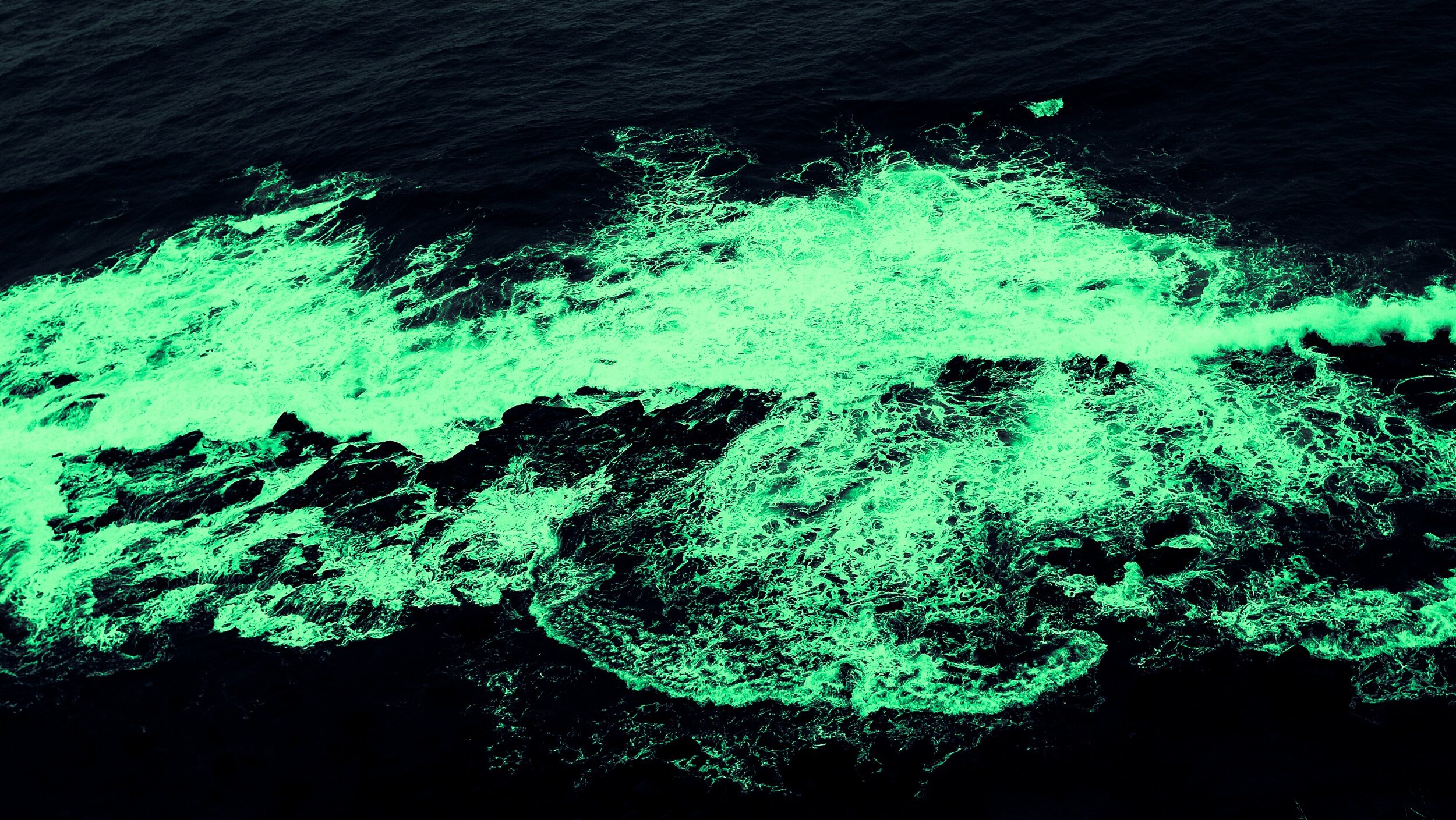  The seas glowed a lime green of caution and intrigue.  Where are we?  