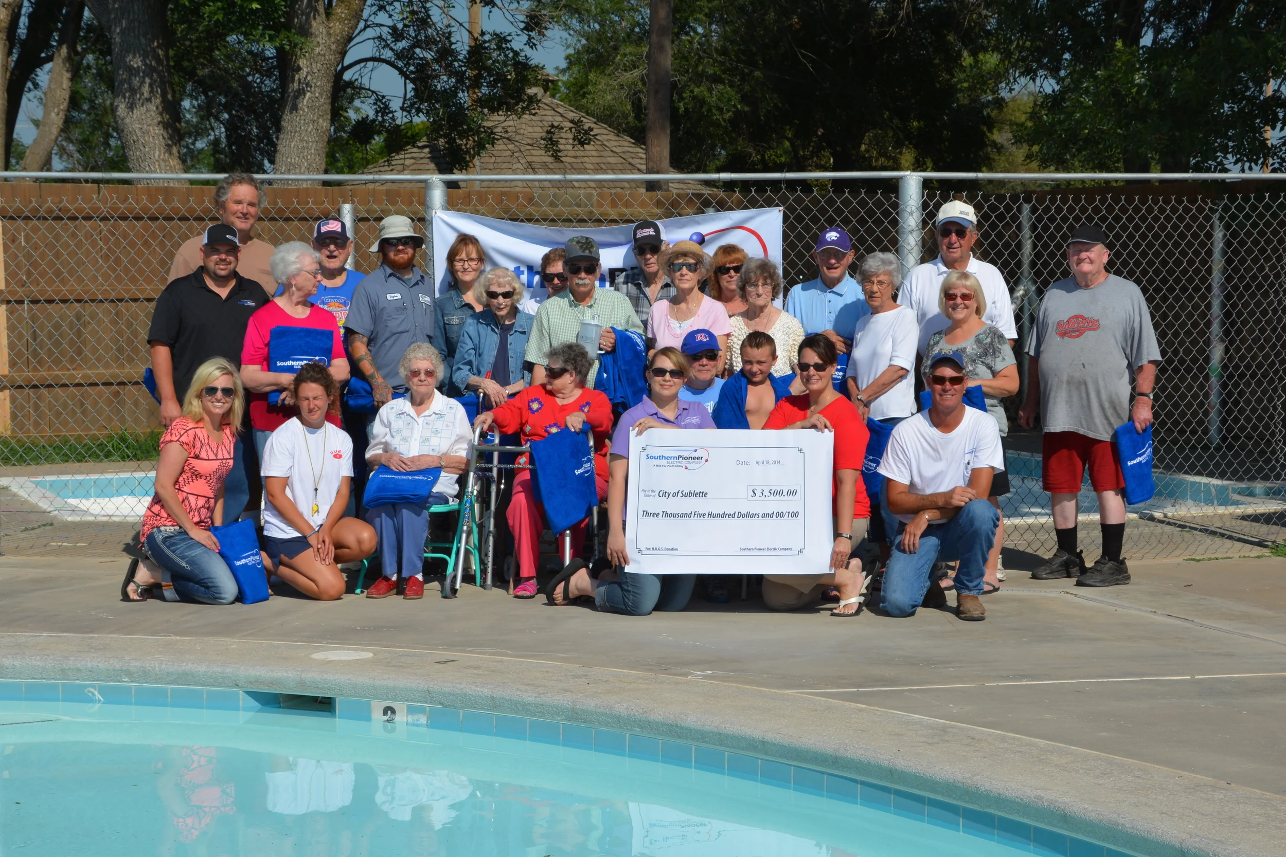 H.U.G.S. Team members presented the City of Sublette with a check for the purchase of a mobile chair lift for the community pool.