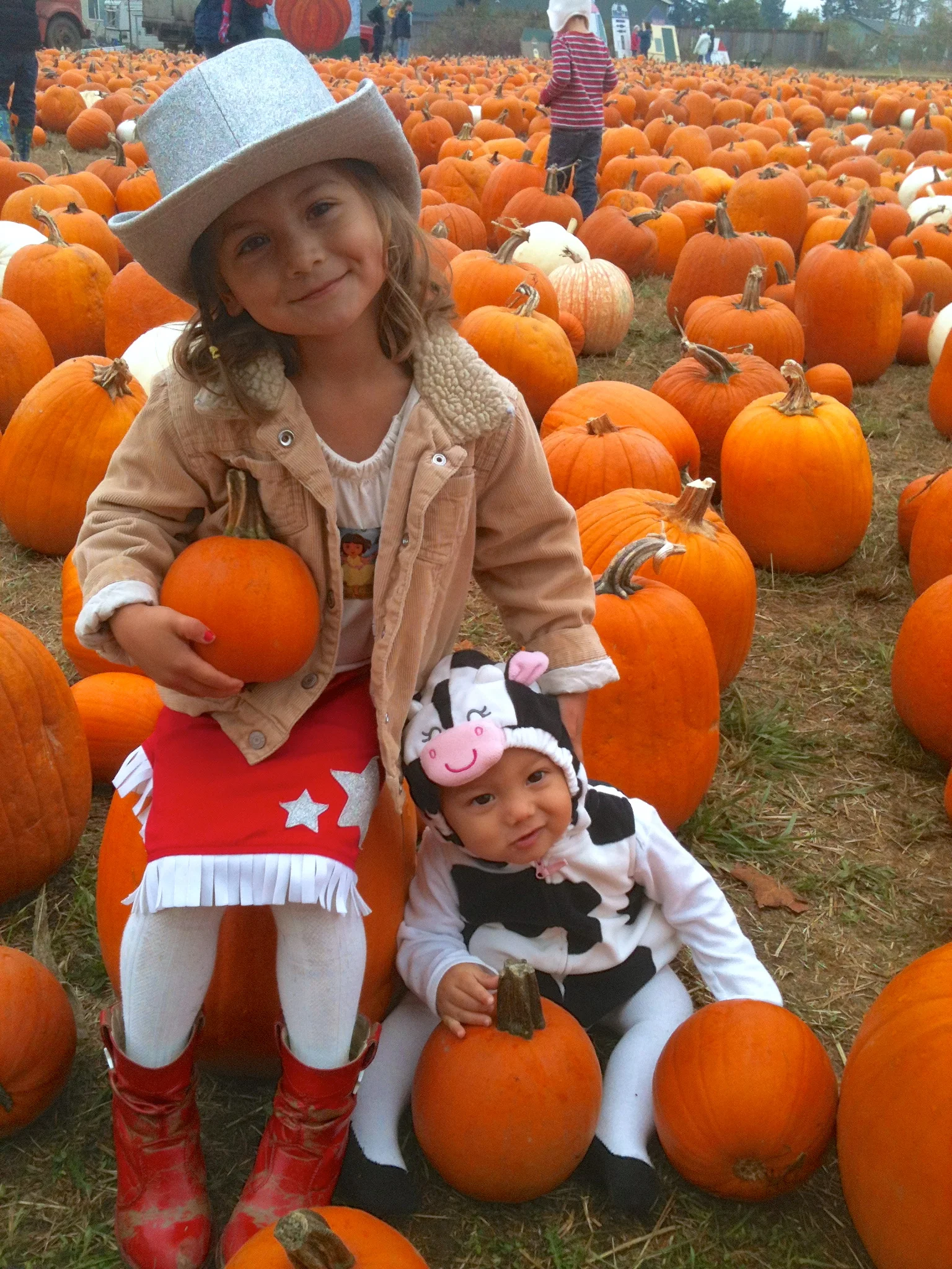 Our little ones at the pumpkin patch last year.