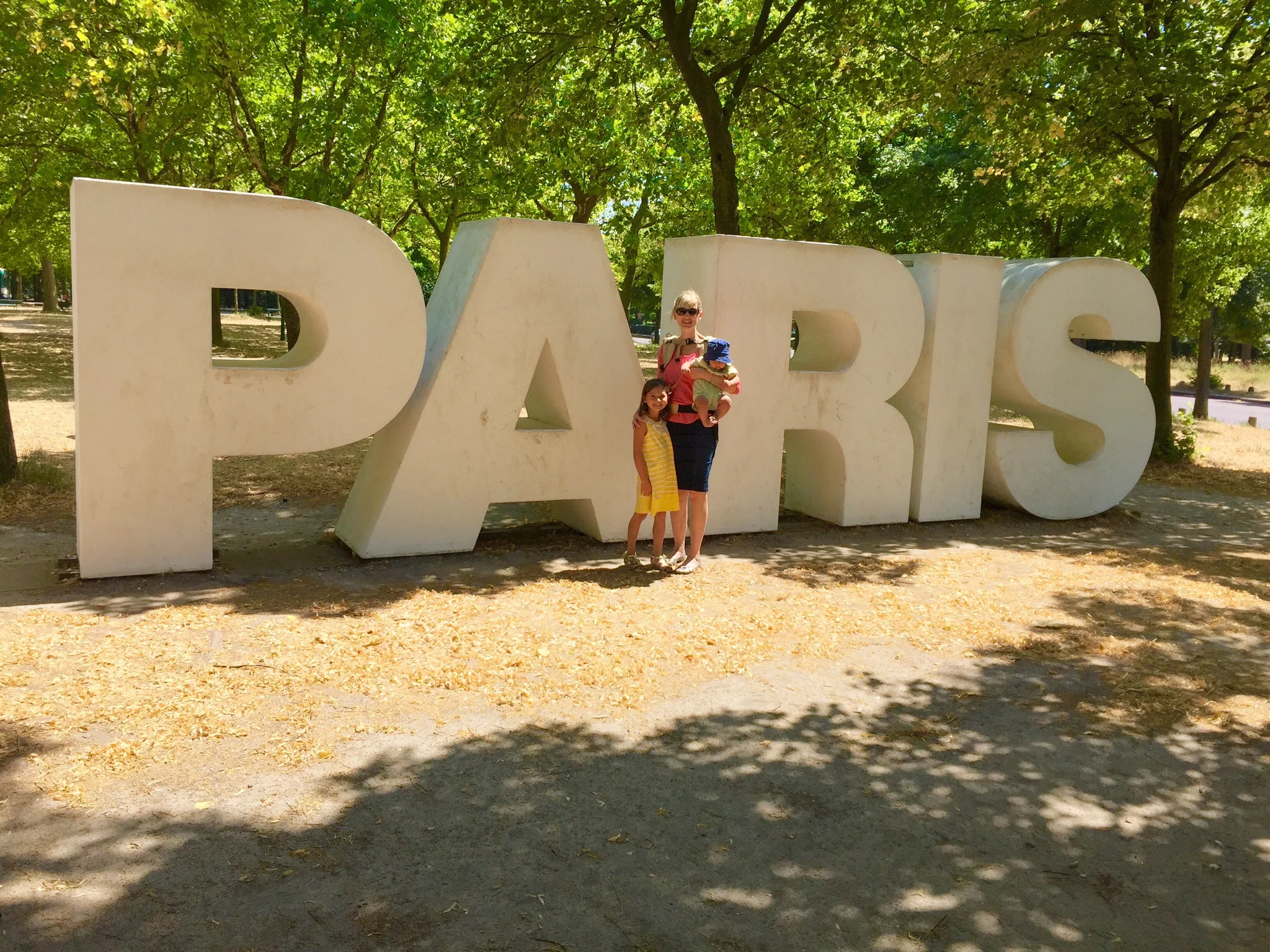 Two of my children with me outside the Parc Floral, Paris