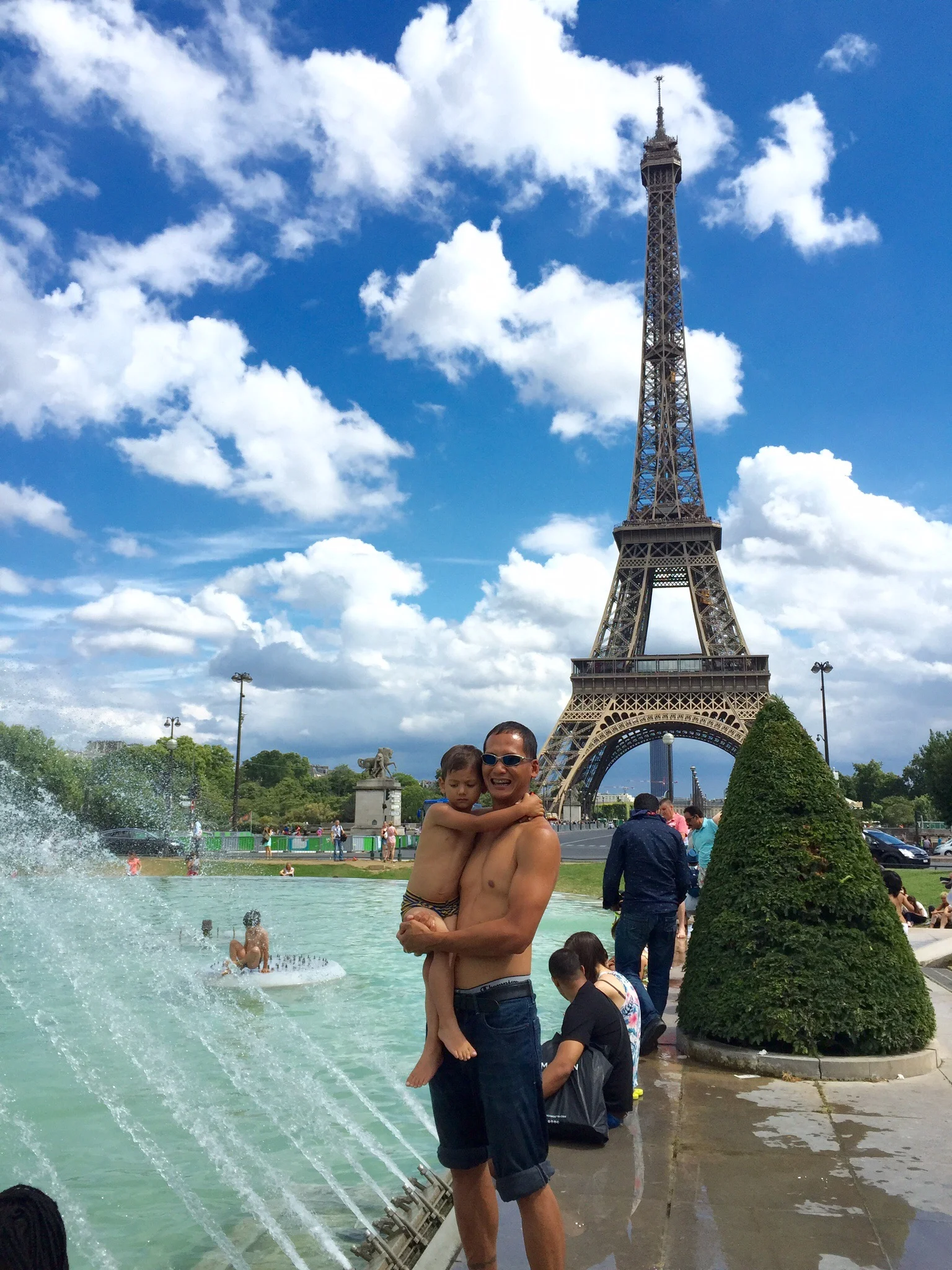 My husband and son at the Trocadero fountain and Eiffel Tower