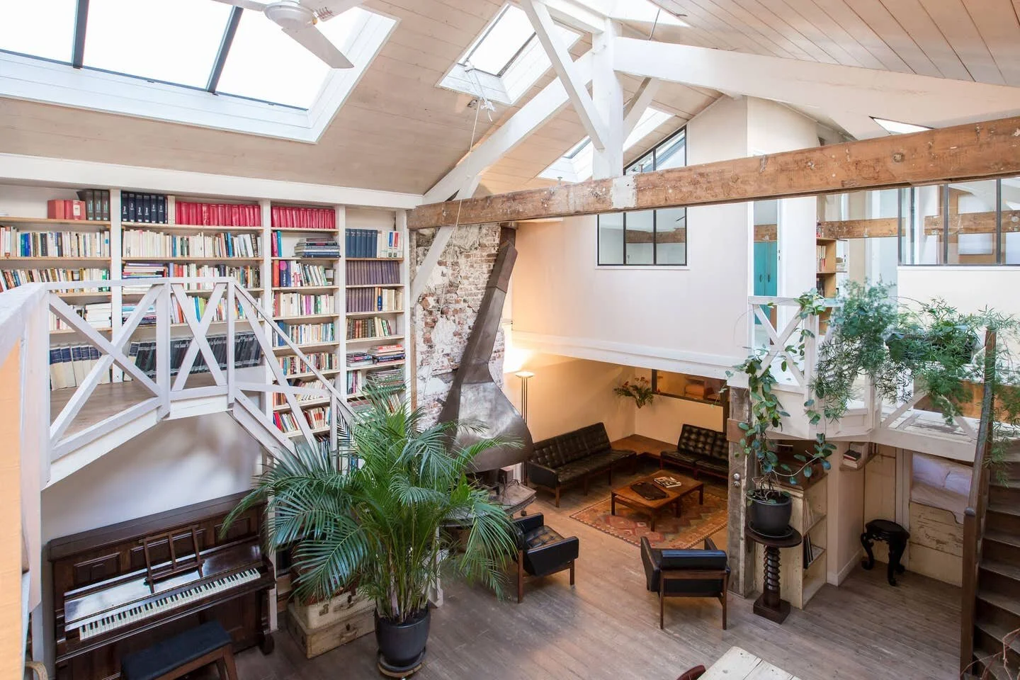 A party pad in Paris with high vaulted ceiling and fabulous fireplace