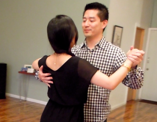 Duet Dance Studio's students practicing the proper dance frame in a private dance lesson.