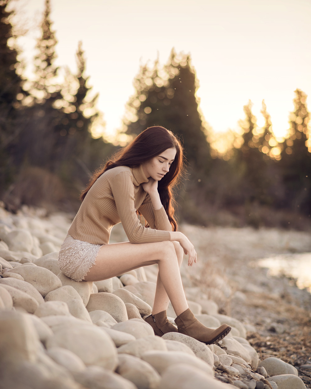 Calgary fashion model sitting on beach