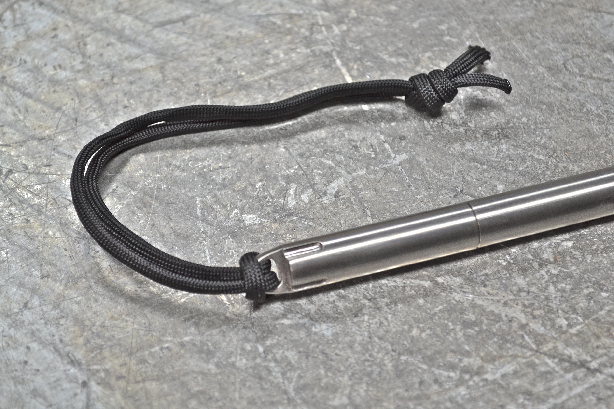 Looped cap with included tether