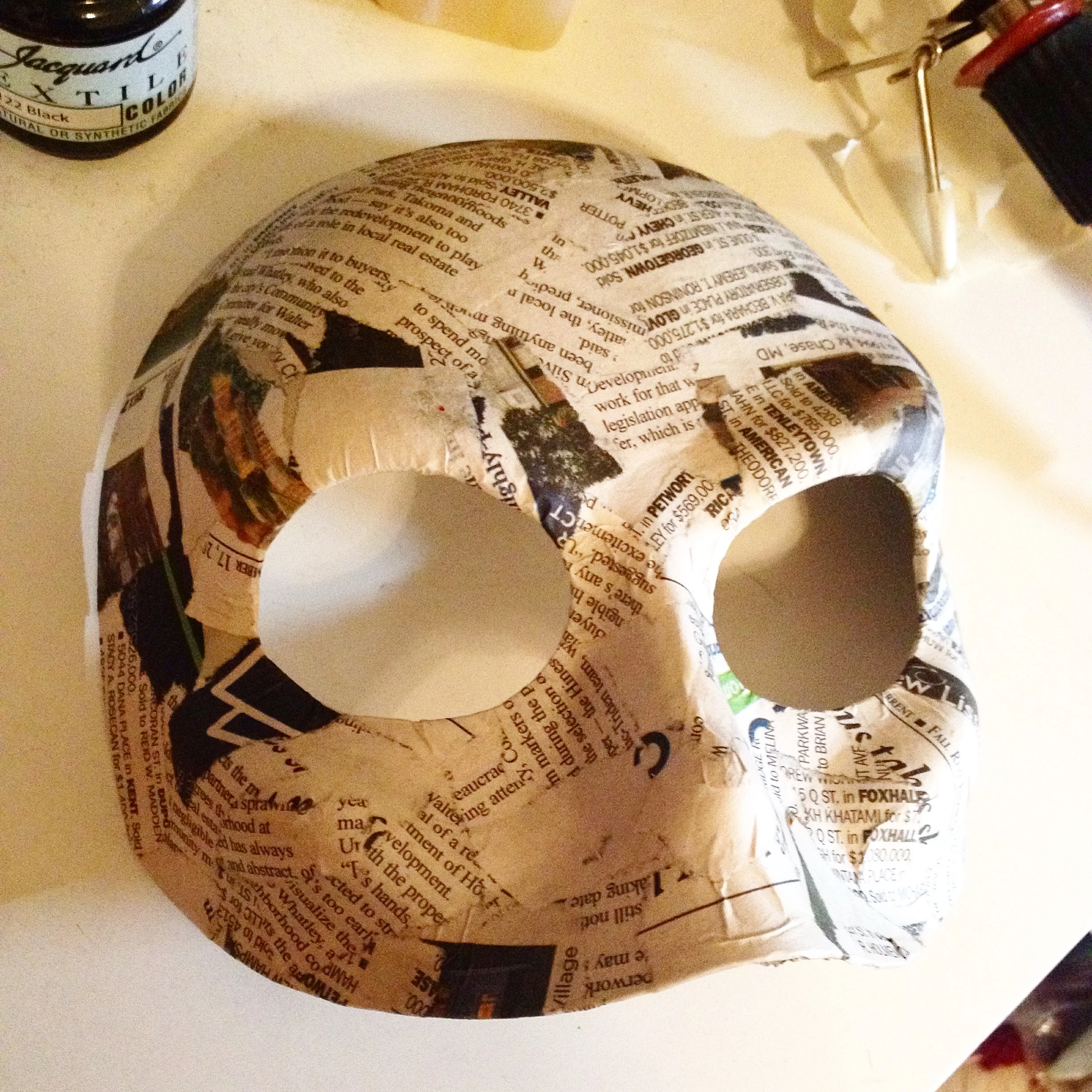 Cut down, reshaped and paper-mached base mask.